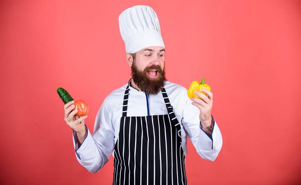Healthy food cooking. Vegetarian. Mature chef with beard. Dieting and organic food, vitamin. Bearded man cook in kitchen, culinary. Chef man in hat. Secret taste recipe. Playing with food - 写真・画像