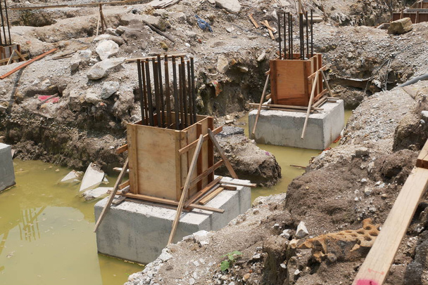 Pile cap and column stump under construction at the construction site. Constructed using reinforced concrete with plywood timber as formwork. - Photo, Image