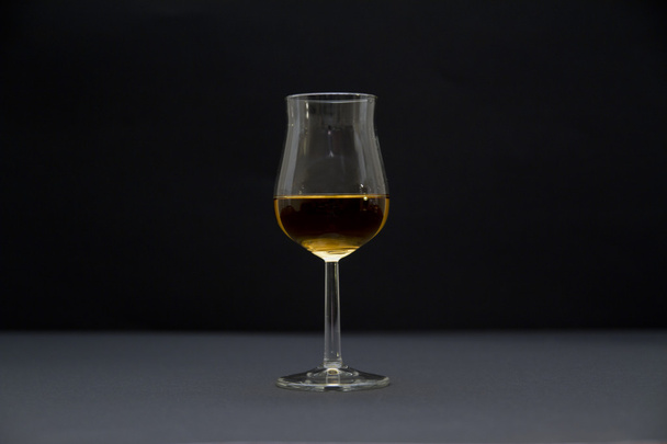 Cognac on black bakground - Фото, изображение