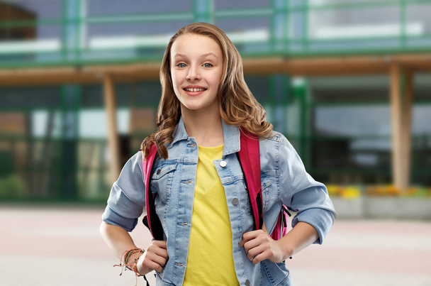 happy smiling teenage student girl with school bag - Valokuva, kuva