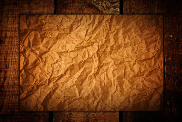 Crumpled paper on wood - Foto, Imagen