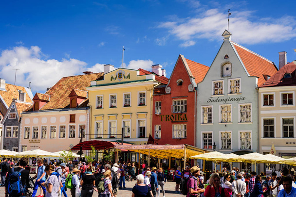 Tallinn, Estonia - July 9, 2018: Sightseeing of Tallinn. Town hall square with historical buildings, beautiful summer view - 写真・画像