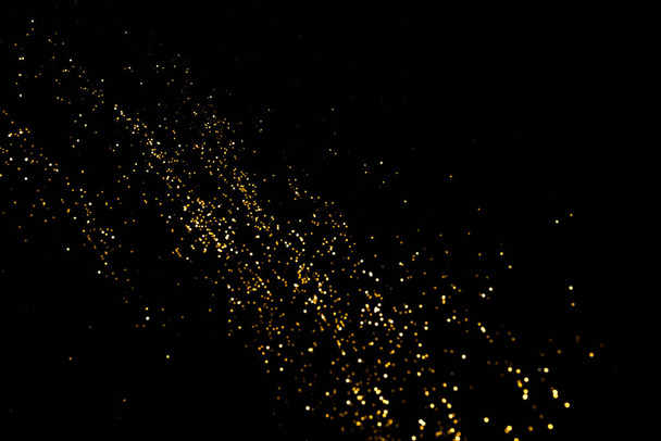 Gold abstract bokeh. Black background - Foto, immagini
