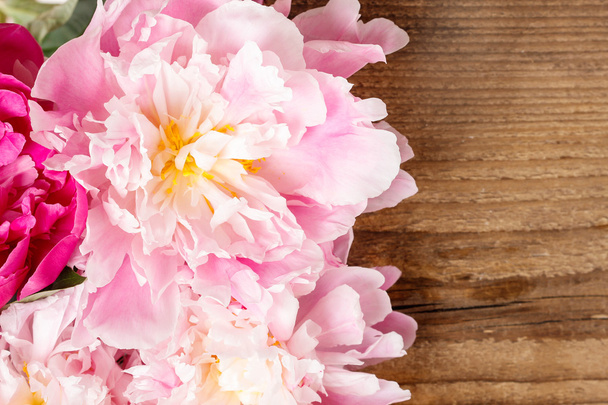 Stunning peonies on wooden background. Copy space. - Photo, Image