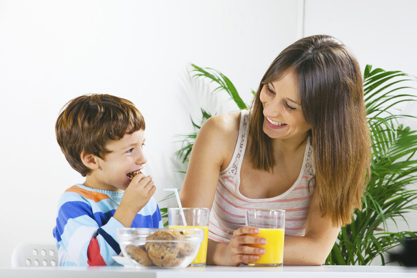 Mother and son having breakfast. - Photo, image