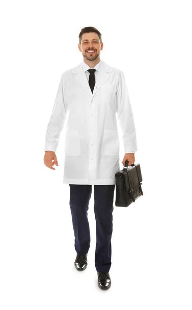 Full length portrait of male doctor with briefcase isolated on white. Medical staff - Photo, Image