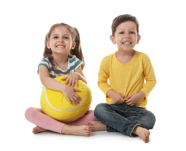 Cute little boy and girl with soft ball on white background - Φωτογραφία, εικόνα