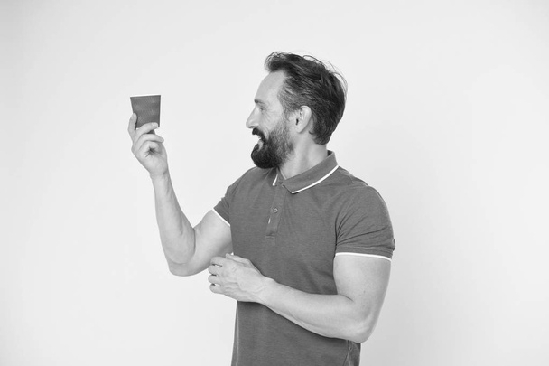 Relaxing coffee break. Drink it on the go. Man bearded prefer coffee take away. Eco lifestyle and recycling. Recyclable coffee cup. Hipster mature man hold paper coffee cup stand yellow background - Foto, Imagem