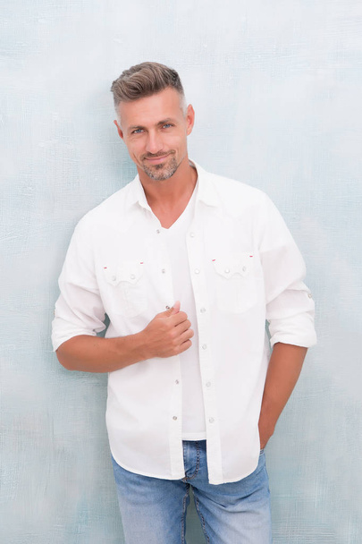 Fashion concept. Man model clothes shop. Mature man model. Feeling comfortable day by day. Menswear and fashionable clothing. Man looks handsome in casual shirt. Guy with bristle wear casual outfit - 写真・画像