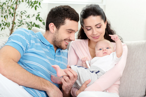 Happy young family with baby - Foto, Bild