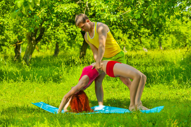 men helping female stretching muscles - Foto, immagini