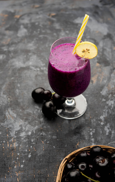 Juice of jamun fruit in a glass also called as java plum, jambolan plum, jambhul, syzygium cumini - Фото, зображення