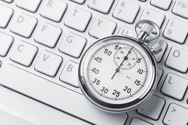 Stopwatch on a laptop keyboard - Photo, Image