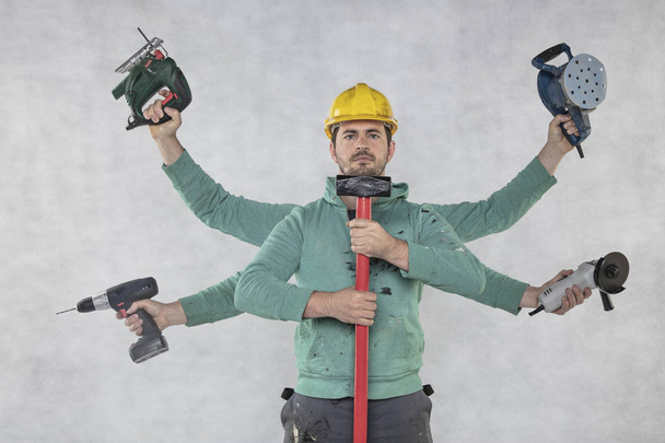 multitasking construction worker ready for construction works - Foto, Imagen