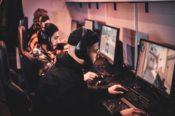 Teenagers are playing videogames at internet club - Fotó, kép