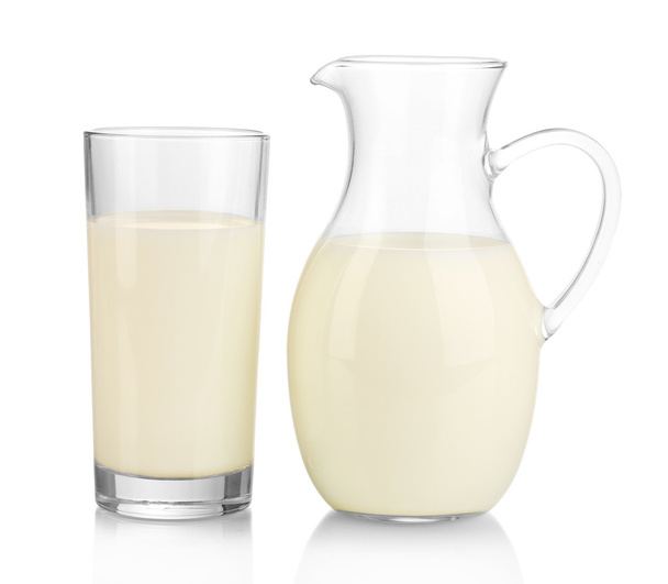 Milk in jug and glass isolated on white - Fotoğraf, Görsel