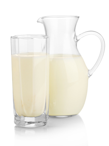 Milk in jug and glass isolated on white - Foto, immagini