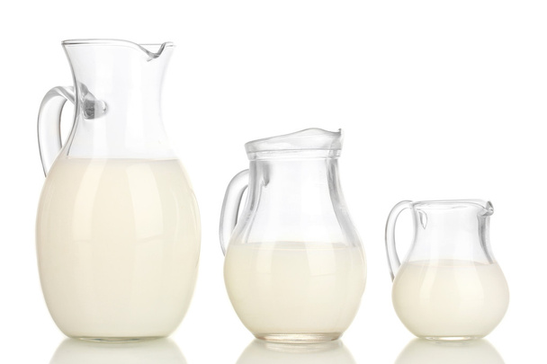 Milk in jugs isolated on white - Fotoğraf, Görsel