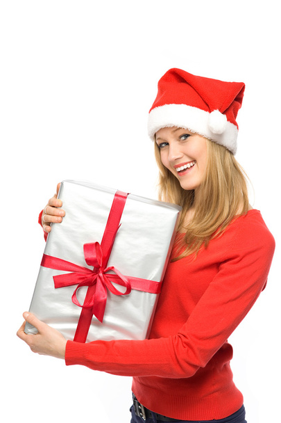 Woman in Santa hat holding gifts - Fotoğraf, Görsel