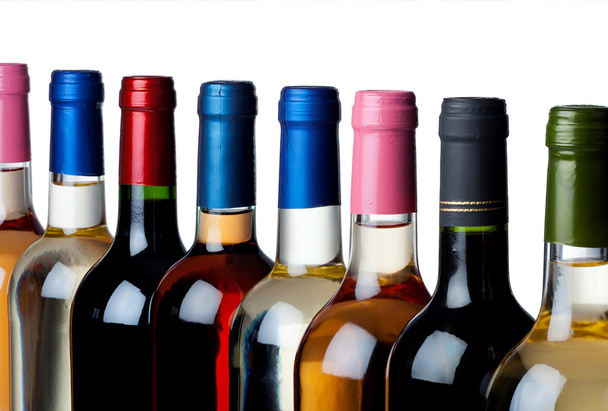 Different wine bottles in a row - Foto, Imagen