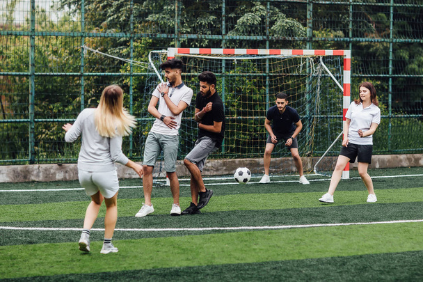 Group of friends training together soccer at stadium - Fotografie, Obrázek