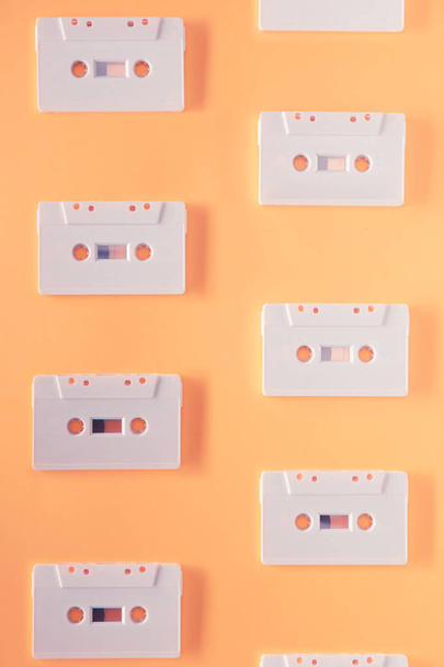 Vintage retro audio cassette on orange background - Photo, Image