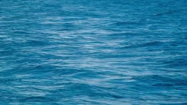 Close-up of Ocean Swells Bobbing in the Wake of a Ship at Sea with Blue Colored Water - Filmati, video