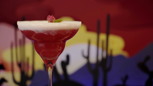 spinning red and cold margarita cocktail with tea rose  - Footage, Video