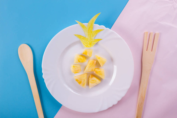 pineapple slices on the blue background - Φωτογραφία, εικόνα