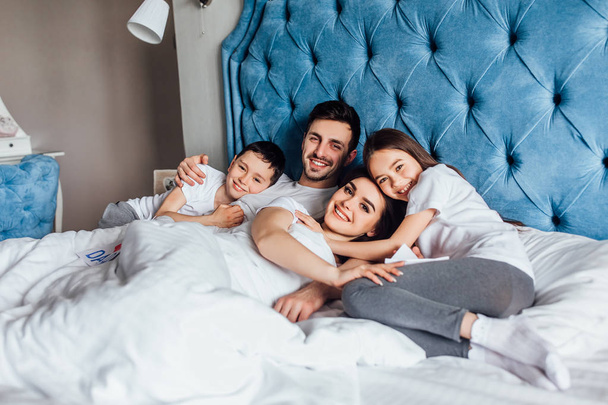 family spending time together in bed at home   - Photo, Image