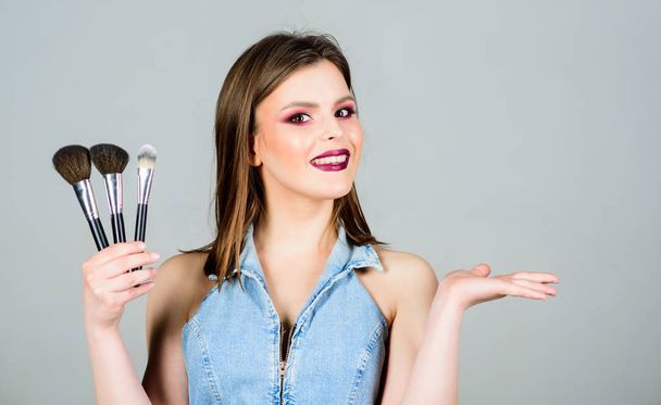 Different brushes. Makeup cosmetics concept. Emphasize femininity. Girl apply eye shadows. Skin care. Looking good and feeling confident. Woman applying makeup brush. Professional makeup supplies - Fotoğraf, Görsel