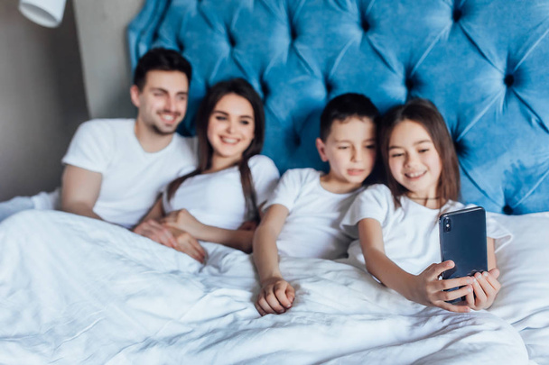 family spending time together in bed at home   - Foto, immagini