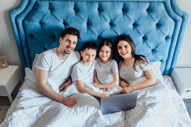 family spending time together in bed at home   - Фото, изображение