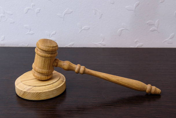 Wooden gavel, judge hammer on wooden background. - Photo, Image