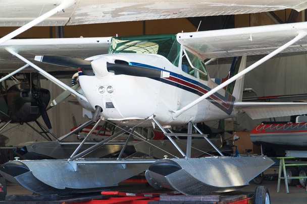 Close-up view of floatplanes (seaplanes) standing in hangar. - Fotoğraf, Görsel