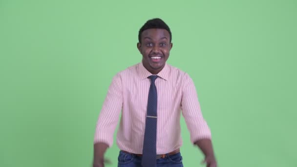 Happy young African businessman getting good news - Filmagem, Vídeo