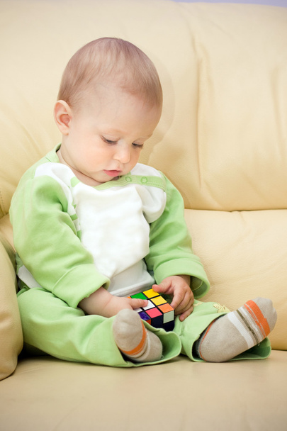 Baby holds cube - Foto, imagen
