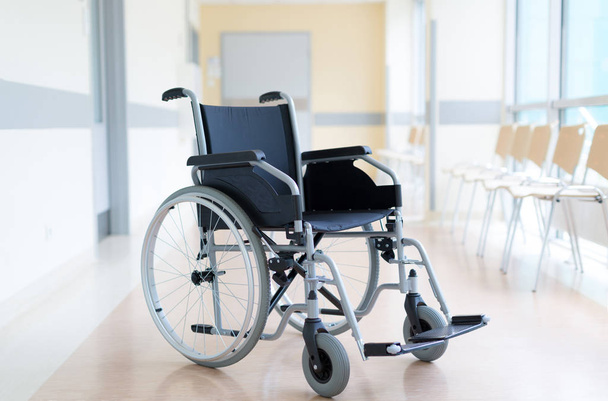 Empty wheelchair in hospital corridor - Photo, image