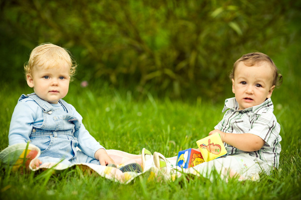 Two boys on the grass - 写真・画像