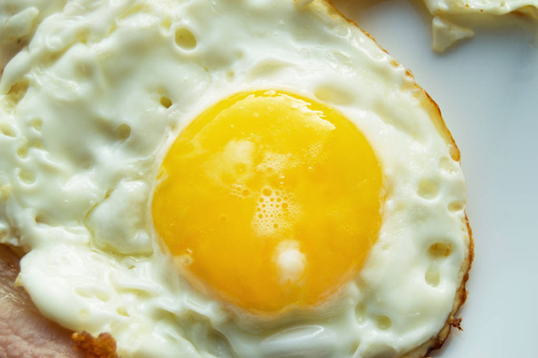 Delicious Breakfast - white plate with fried egg, close-up - Photo, Image