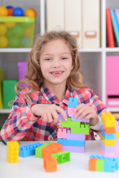 girl playing with plastic blocks - Photo, image