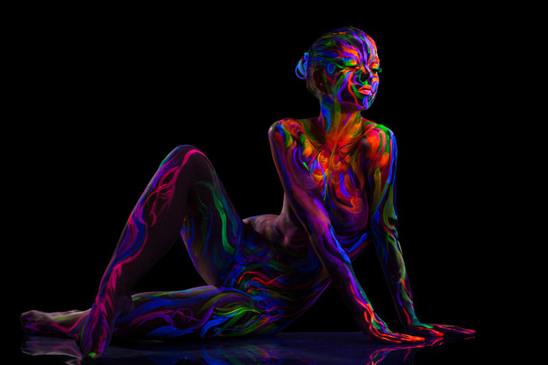 Sensual dancer posing with luminous makeup - Photo, Image