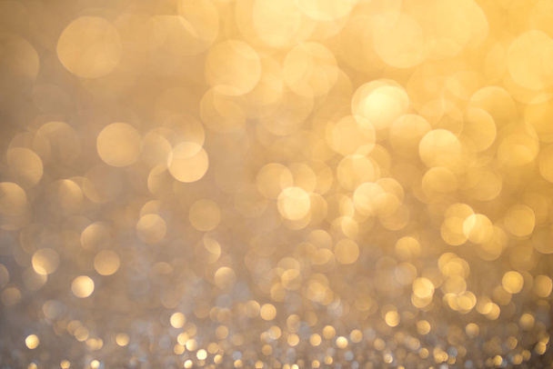 Silver glitter christmas abstract background in golden light - Photo, image