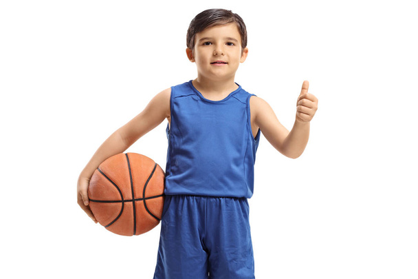 Little boy with a basketball making a thumb up gesture - Fotografie, Obrázek