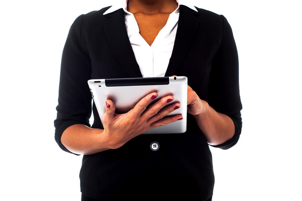 Cropped image of a woman holding touch pad - Foto, imagen