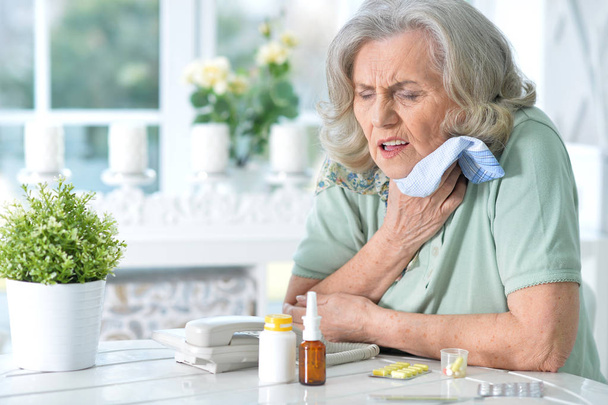 Sick senior woman - Фото, изображение