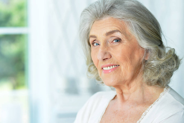 close up portrait of beautiful smiling senior woman - Photo, image
