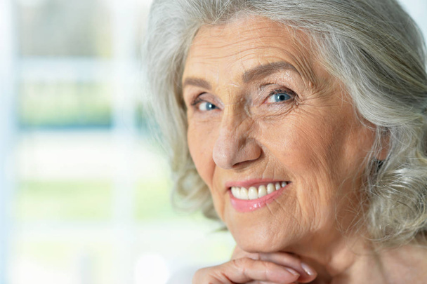  close up portrait of beautiful smiling senior woman - Фото, изображение