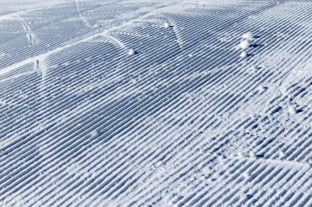 Snow on the prepared ski slopes sunny winter day - Fotoğraf, Görsel
