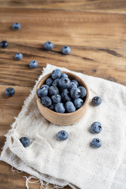 Fresh blueberries on rustic wooden table - Fotografie, Obrázek